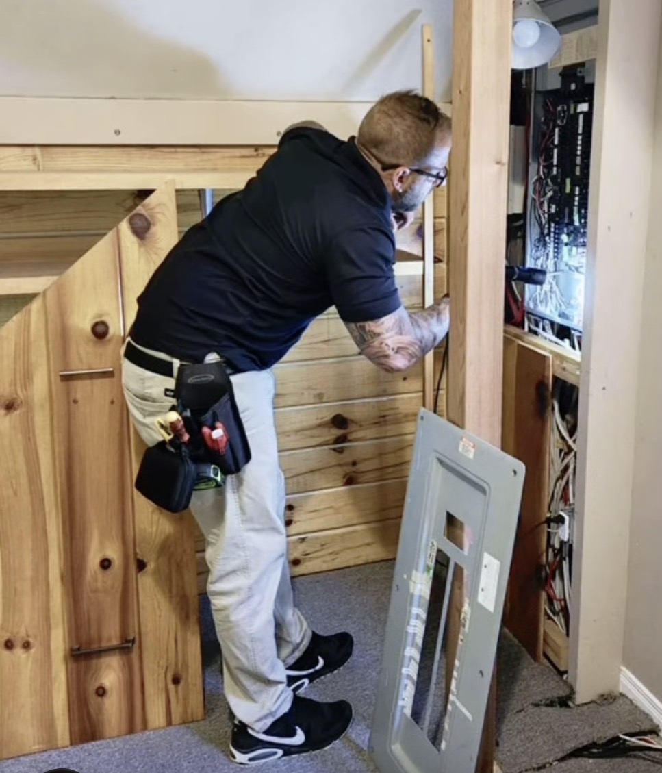Licensed inspector checking electrical panel in Fort Lauderdale home