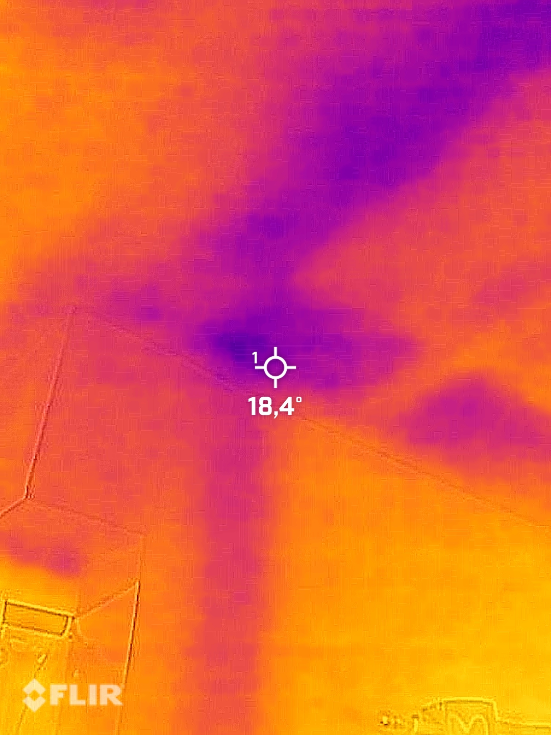 Aerial FLIR thermal image of roof identifying heat-loss pattern and potential leak